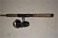 Garcia Mitchell 308 fishing reel with a rod; as is
