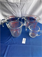 Group of Pyrex Measuring Cups