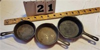 3 unmarked Cast Iron Skillets