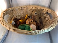 Lot of plush squeaky toys and wicker basket