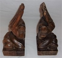 Wooden hand book ends.
