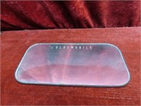 Oldsmobile automobile mirror.