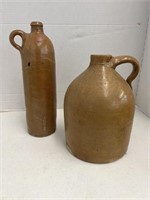 Two crock jugs (one damaged)