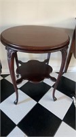Antique cherry round side table intricate cut