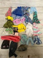Lot of modern barbie clothes
