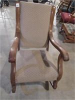 Antique upholstered rocking chair