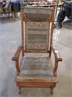 Antique upholstered rocking chair