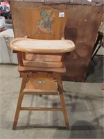 Antique wooden high chair with decal