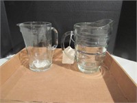Two glass pitchers
