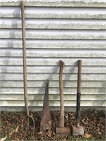 FOUR TOOLS A THREE TINE PITCHFORK HAND SAW AXE