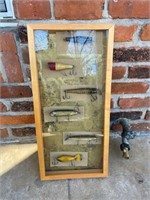 shadow box of old fishing lures