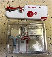 Handheld singer sewing machine