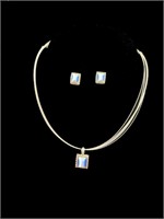 Silver necklace and earrings with blue stone