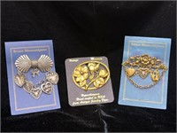 Set of three brass pins