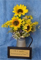 Sunflower arrangement in metal pitcher