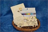 Wooden craft basket with paint pens and art pieces
