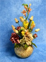 Autmnal floral arrangement in dried gourd