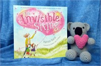 "The Invisible String" book and stuffed koala