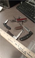 FOUR POCKET KNIVES AND A MULTI TOOL