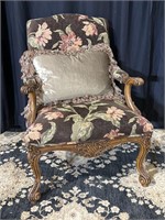 Beautiful upholstered carved arm chair