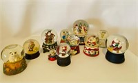 Collection of Snow Globes and Music Boxes