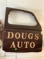 Doug’s Auto sign painted on car door