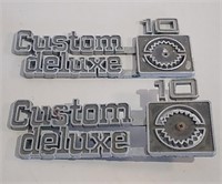 Two Vintage Chevy Custom Deluxe 10 Emblems