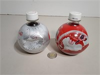 Two Unopened Coca-Cola Holiday Bottles 2009 &