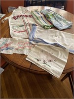 Vintage aprons, tablecloth, and doilies