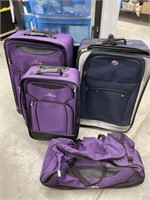 Lot of suitcases set of 3 purple skyway and