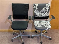 2 BLACK METAL ADJUSTABLE OFFICE CHAIRS W/ COVERS