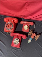 Antique toy telephones, large red one does have a