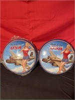 Two round metal signs, military
