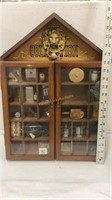 Wall display case full of small Collectibles