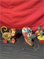 Vintage metal tops, monkey pull toy and