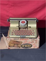 Toy metal typewriter in case