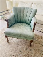 mint green upholstered tufted chair by Tynan