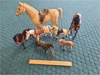 Lot of various size toy horses