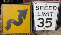 2 metal road signs