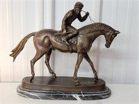 Bronze racing horse mounted on marble base look