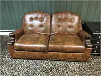 Brown vinyl loveseat