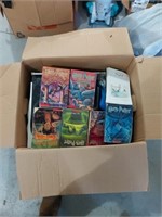 Box of clothes and Harry Potter books