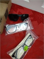 Two pairs of blue light glasses and sunglasses