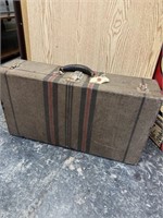 vintage suitcase full of linens