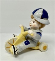 Ceramic Figure on Tricycle