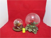 two beautifully decorated globes, one is Bard