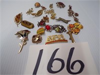 24 BROOCHES
