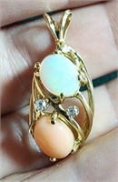 Unmarked Opal and peach colored stone pendant