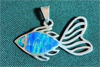 Sterling silver and turquoise colored stone fish