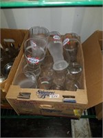Box of beer glasses and sugar containers